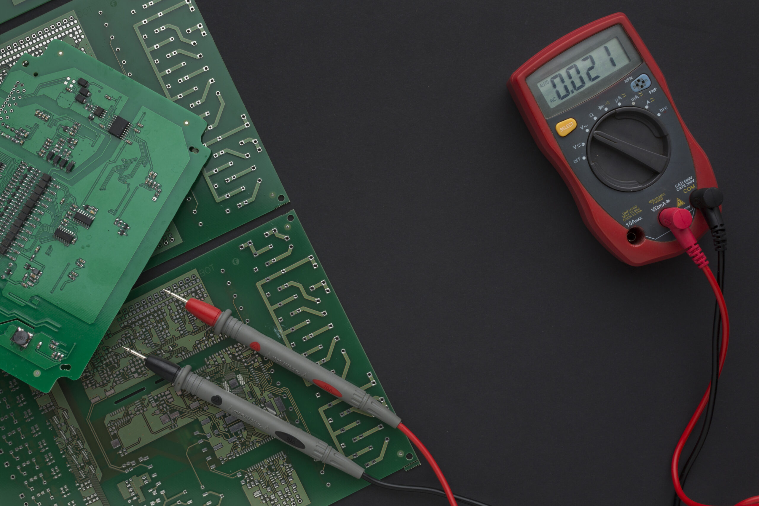 close-up-circuit-board-with-multimeter